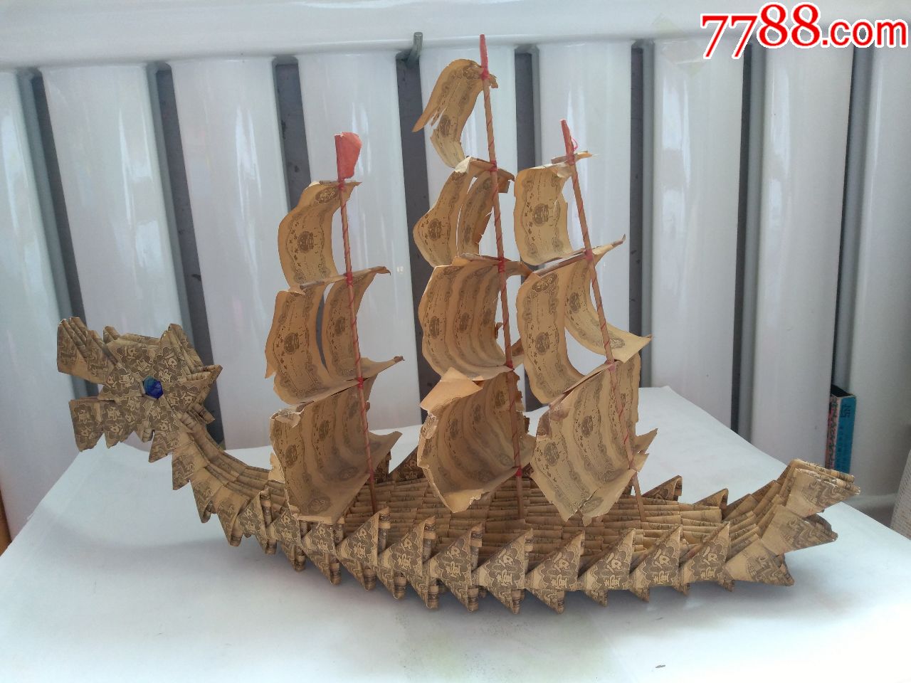 一分纸币折叠的龙船摆件,点图可放大