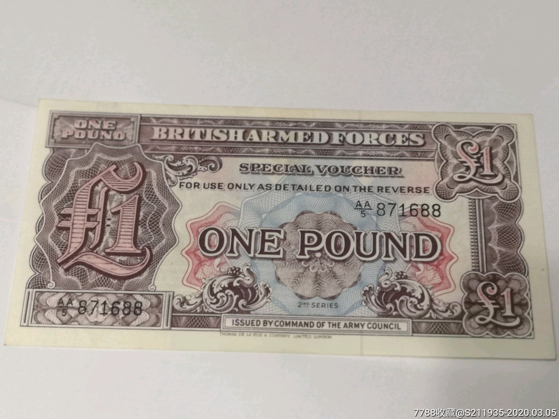 不知道哪个国家的,应该是一英镑￡纸币,号码好688喜欢