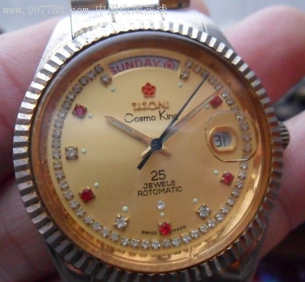 一款瑞士梅花王全自动双日历25钻手表,金黄色的瑞士