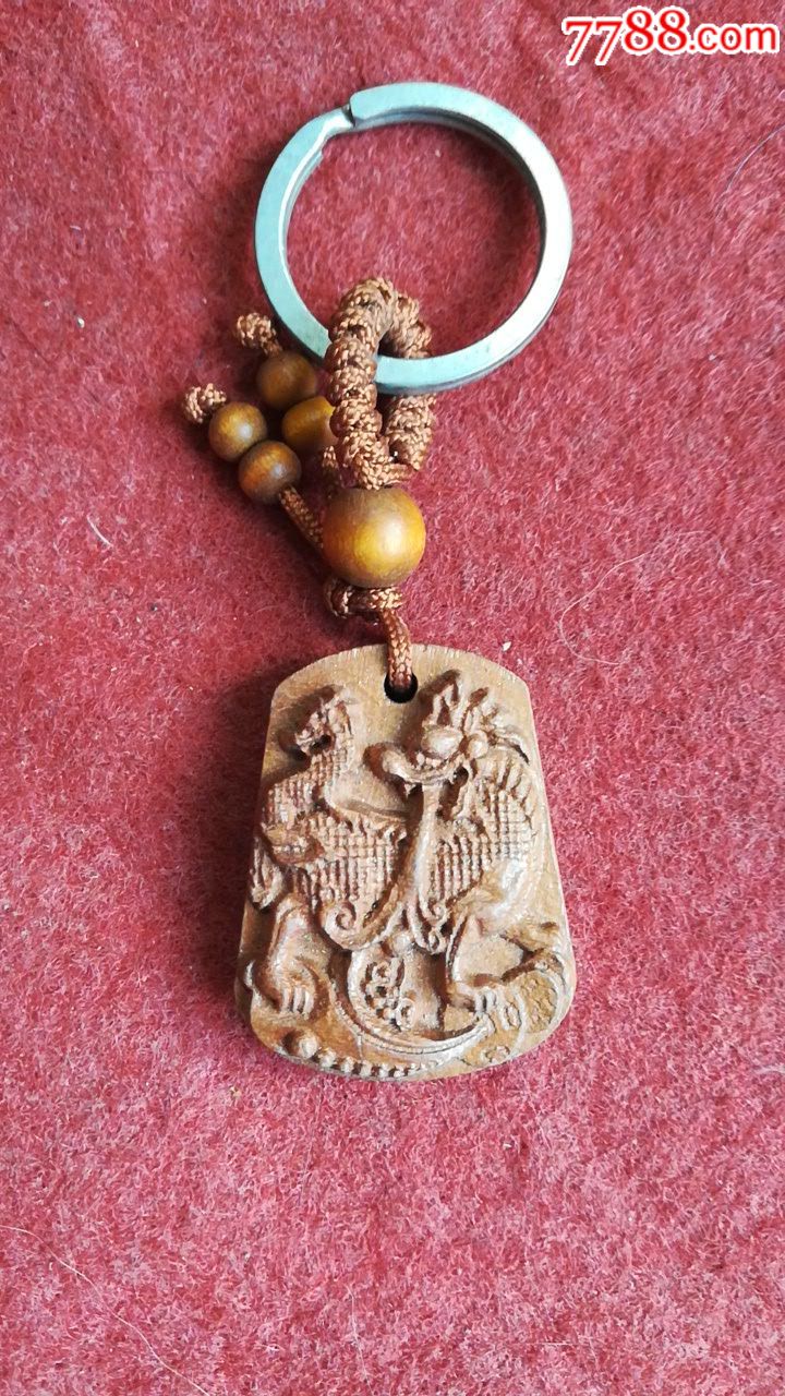 一个红木雕刻的麒麟关宝出入平安挂件品相如图自定