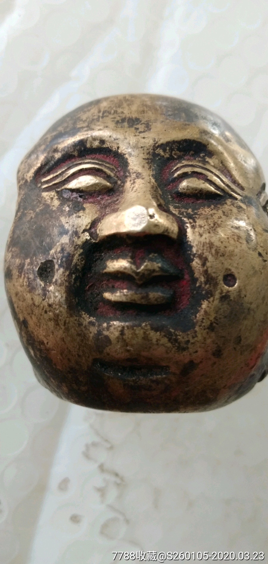 三面铜佛头