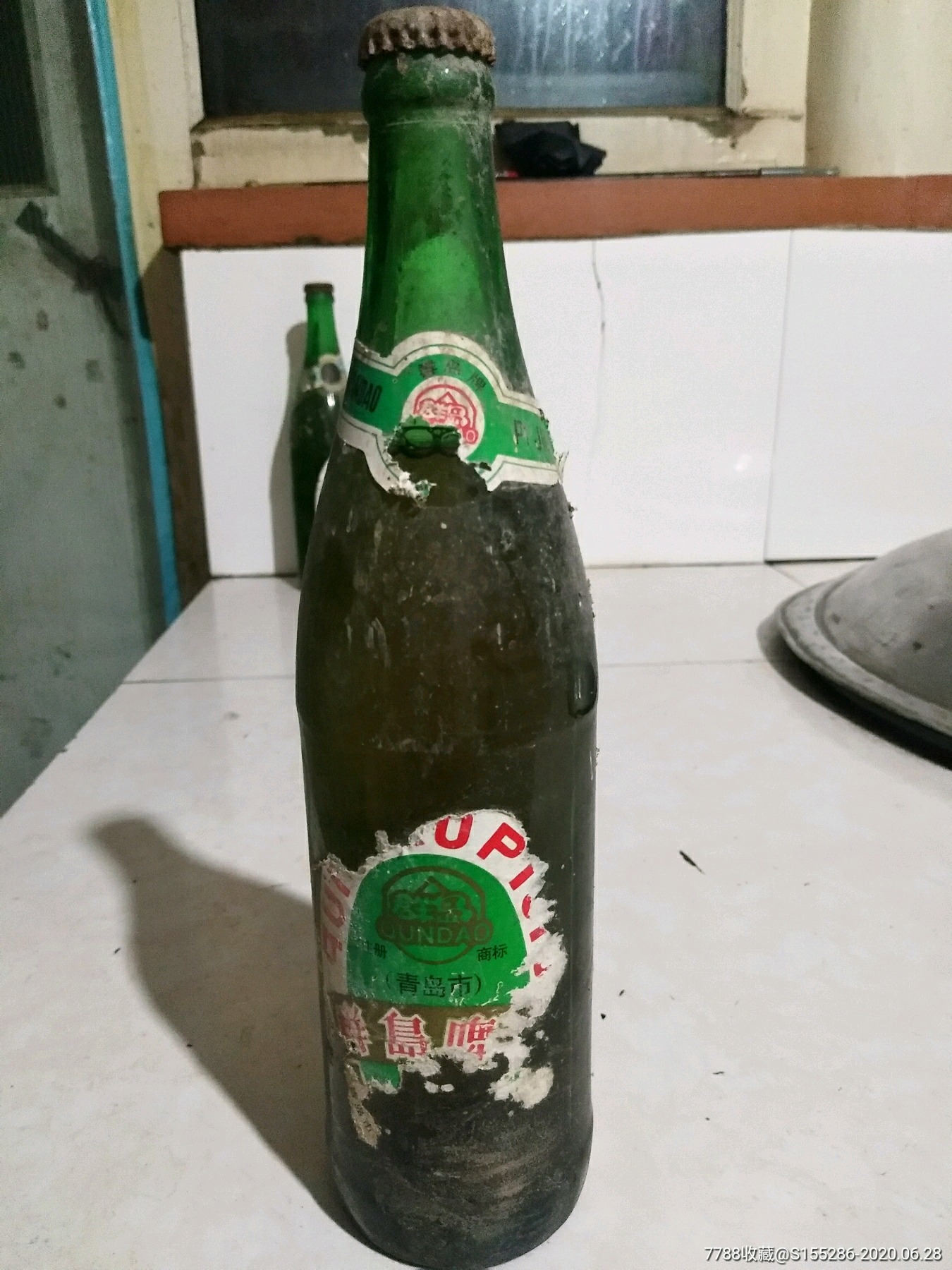 90年代青岛产的群岛啤酒,品相如图酒满,包老包真