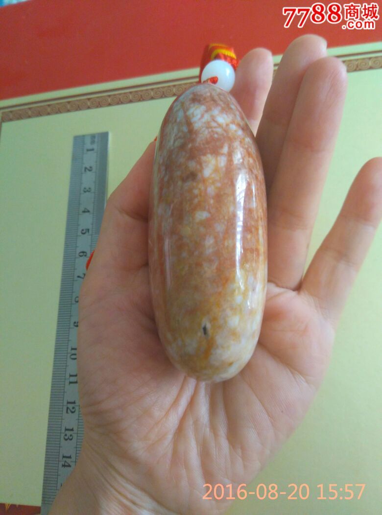 超美红花椭圆形新疆克拉玛依金丝玉手把件