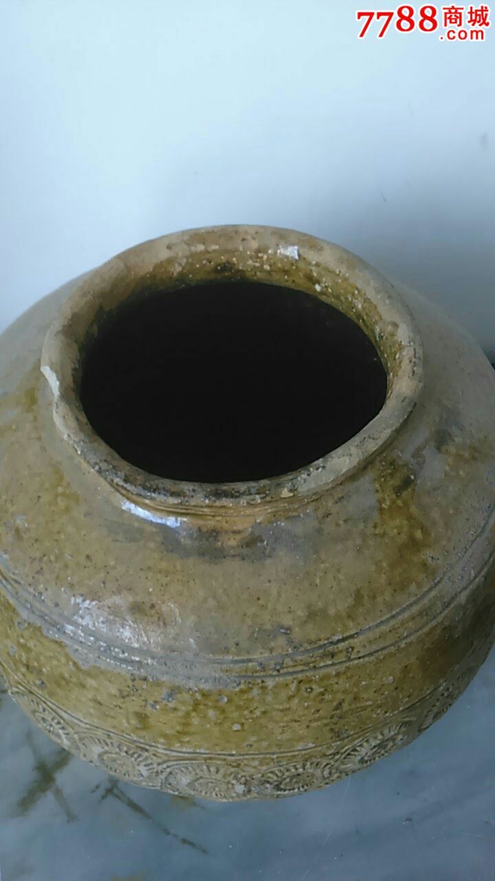 出土金钱纹陶罐